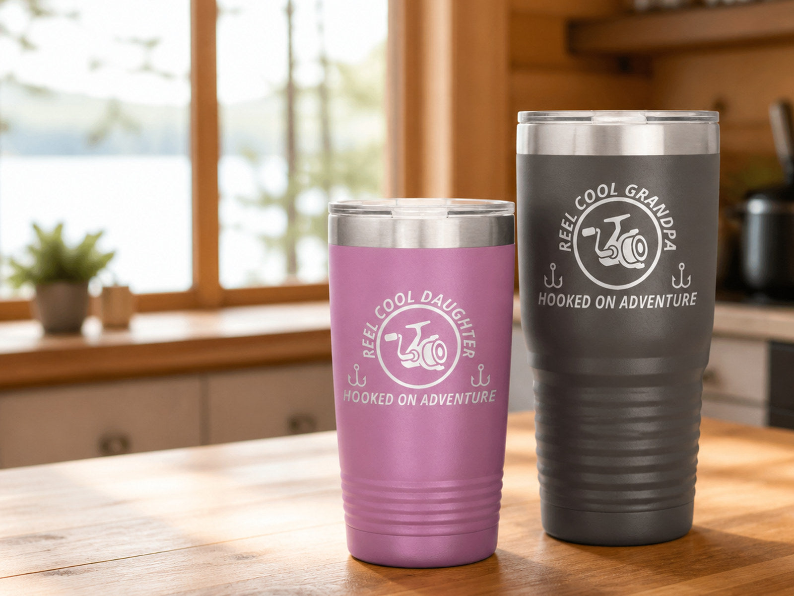 Light-purple 20-ounce and pewter 30-ounce engraved tumblers on a bright cabin kitchen counter.