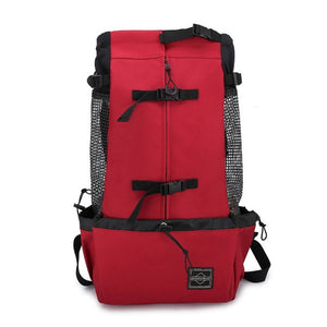 Red adventure pet carrier backpack – front view with pockets and buckles