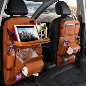 Brown road trip seat-back organizer with trash bin, cup holders and storage pockets in back seat