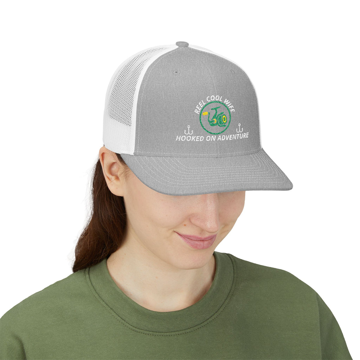 Reel Cool Wife embroidered trucker cap on model, front side view, heather grey front with white mesh back